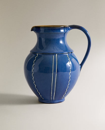 Blue ceramic vase with white stripes